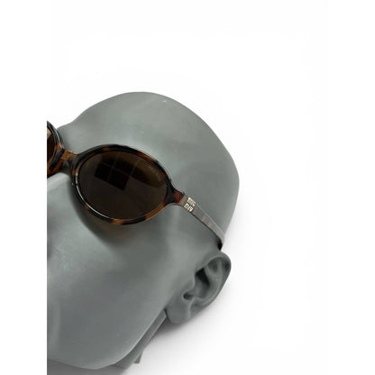 Miu Miu Oval Tortoiseshell Sunglasses
